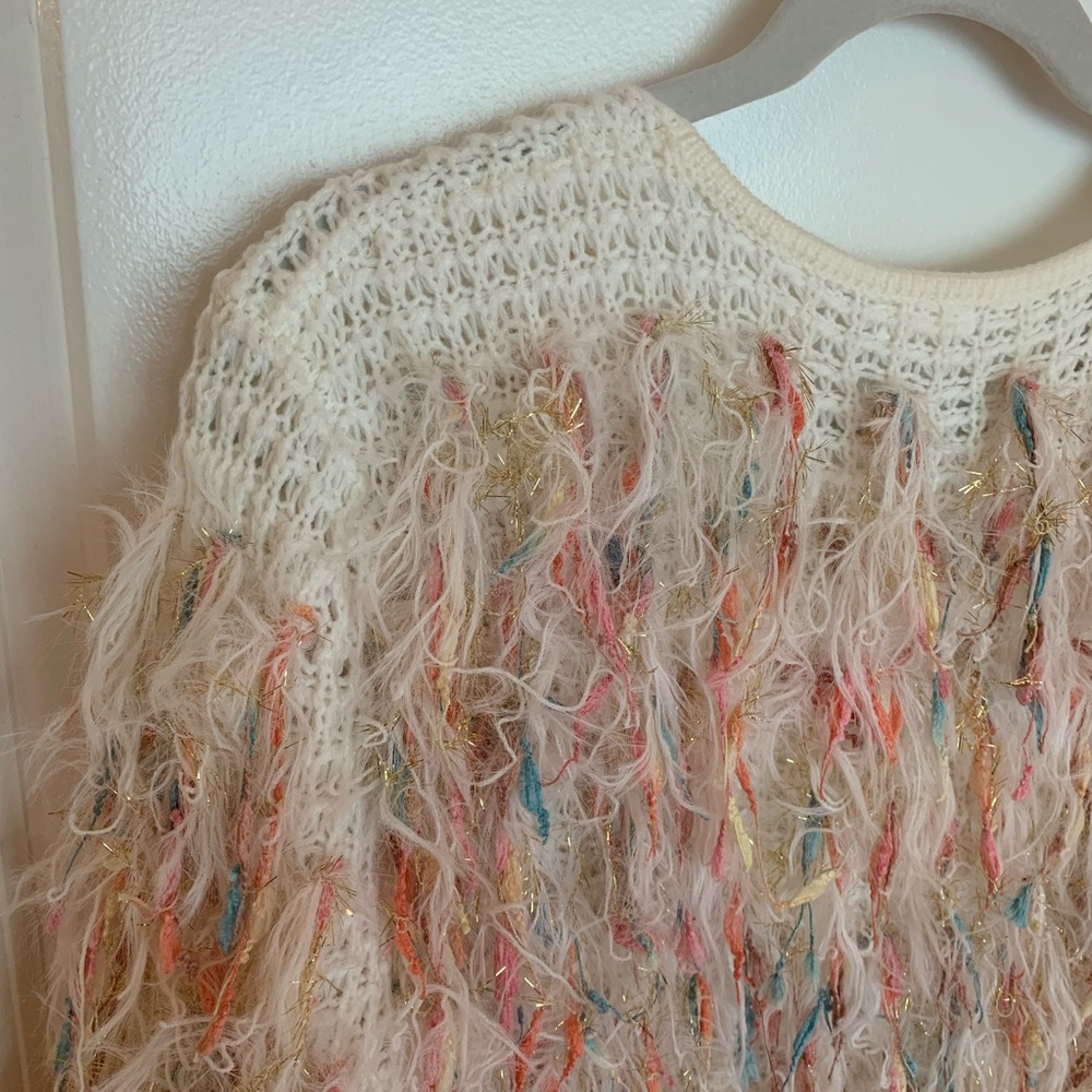 Fun rainbow sweater, perfect with jeans and a white tee!